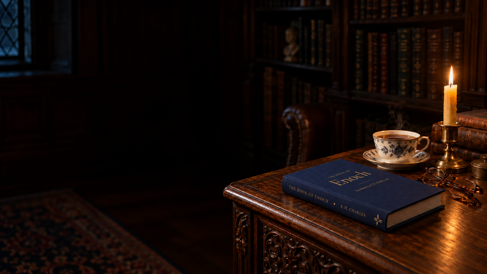 The Book of Enoch in navy cloth with a gilt-stamped spine, lying closed on an oak desk by candlelight beside a teacup and reading glasses.